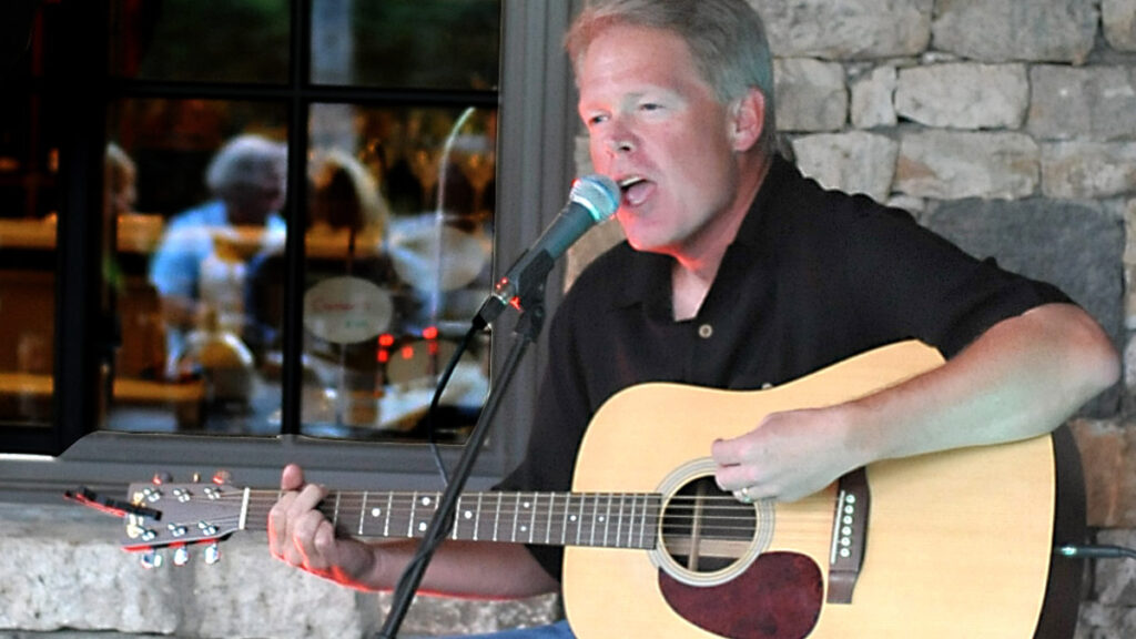 Tom Shull playing the guitar